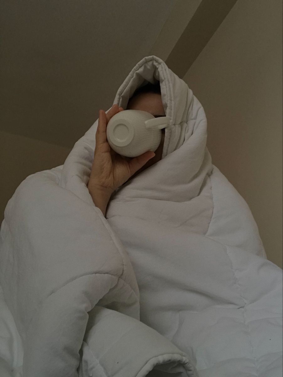 Wrapped in a duvet with a morning mug