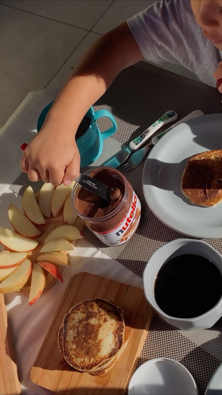 A child at a sunny pancake breakfast